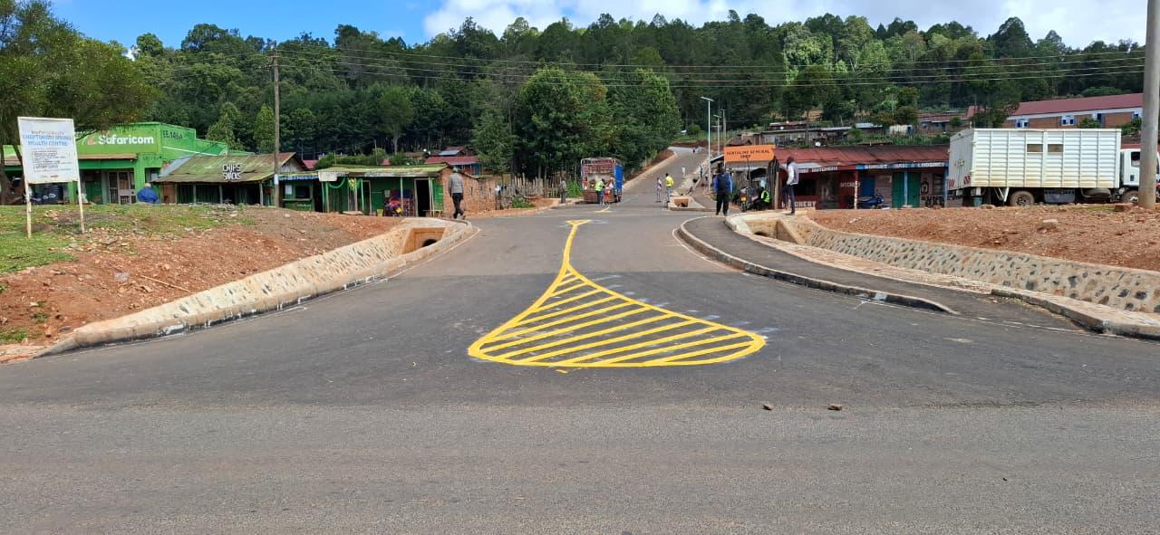 Completed road intersection with drainage, walkways and markings